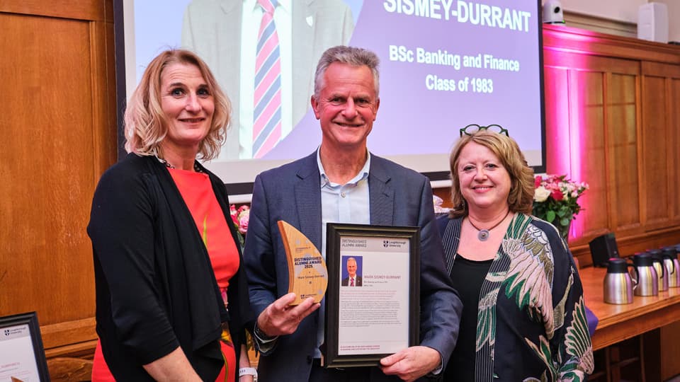Professor Jan Godsell and Dr Cheryl Travers present a Distinguished Alumni Award to Mark Sismey-Durrant.